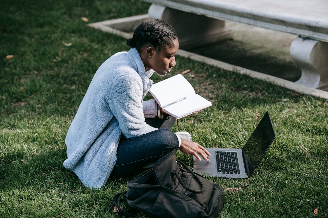 Student on their laptop outside