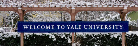 Welcome to Yale University sign covered by snow