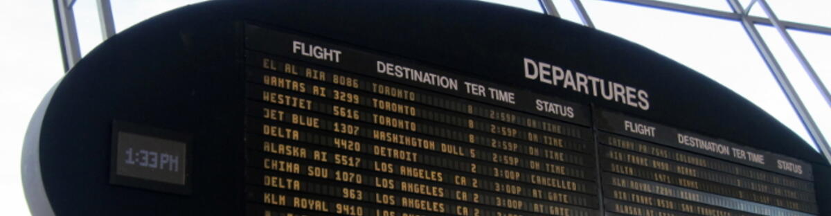 Airport departures time-board with multiple flights showing