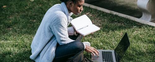 Student on their laptop outside